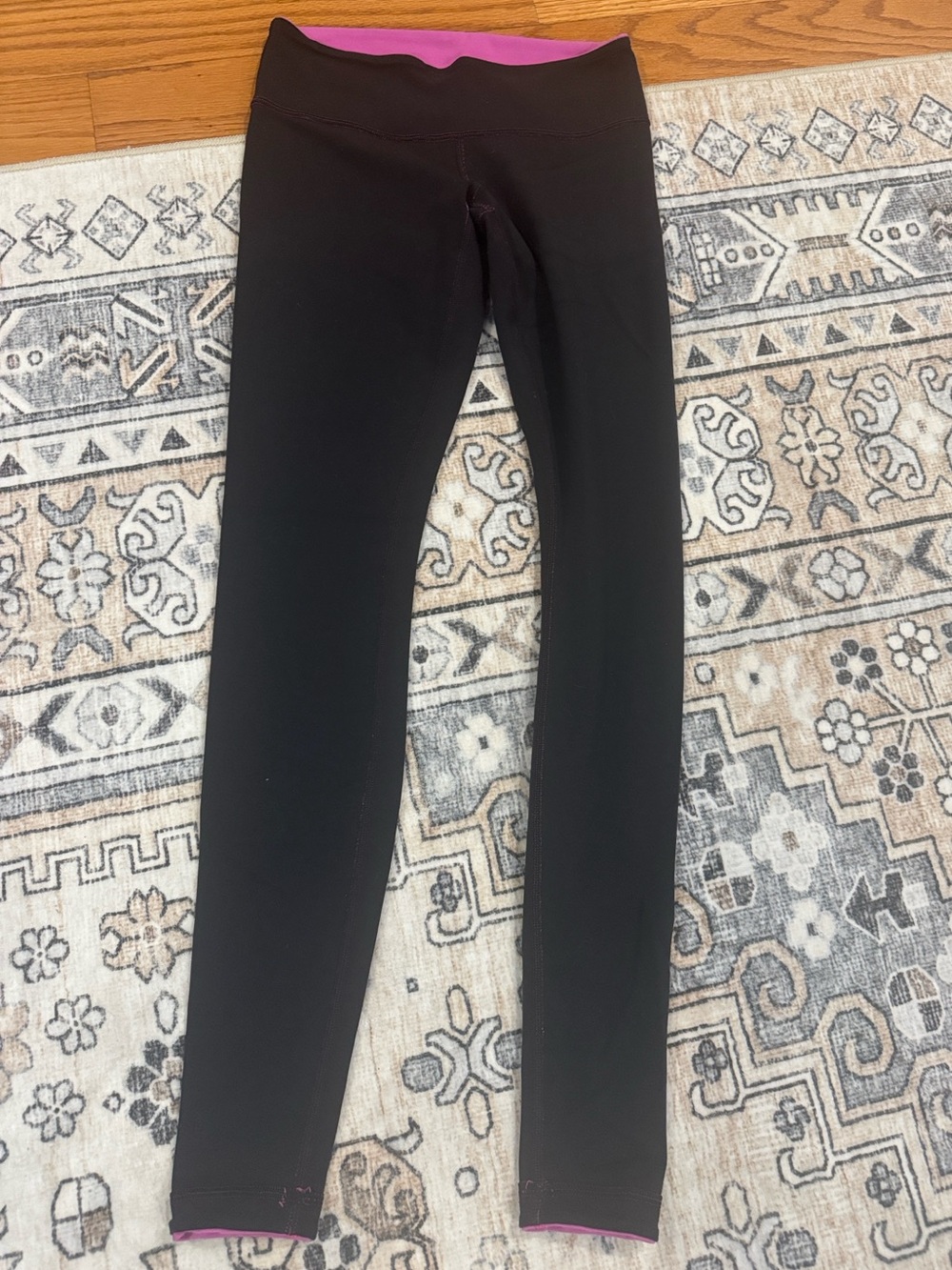 Lululemon Women's Reversible Black and Pink Leggings- no size listed but size 4